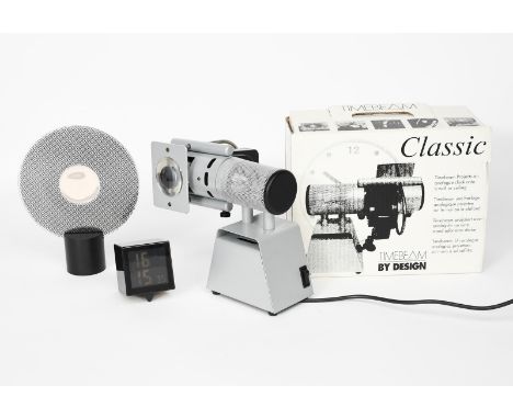 A Timebeam electric projection analogue clock, in original retail card box, another Timebeam projection clock with White Chri