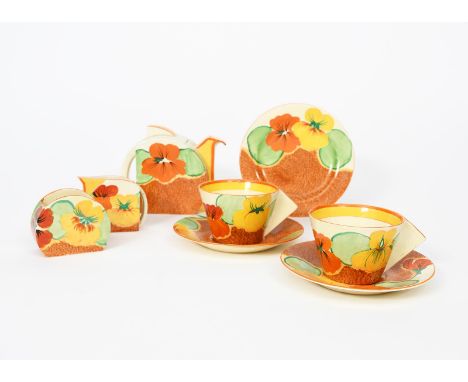 'Nasturtium' a Clarice Cliff Bizarre Stamford tea for two, painted in colours, comprising, teapot and cover, milk-jug and sug