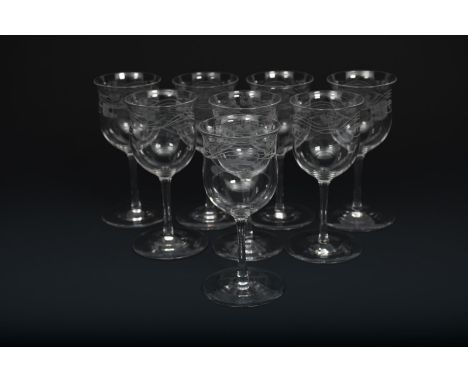 A set of eight James Powell &amp; Sons Whitefriars glass Lotus sherry glasses designed by Harry J. Powell, each engraved with