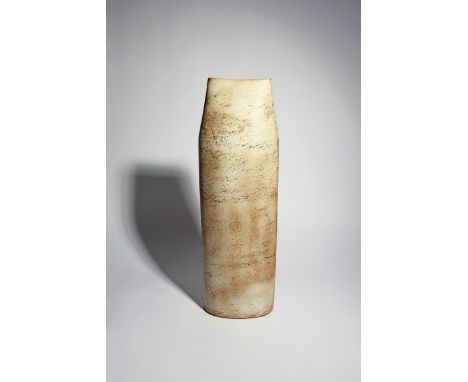 Joanna Constantinidis (1927-2000) a tall oxidised stoneware vase, 1971, flattened, elliptical form, covered in a pitted cream