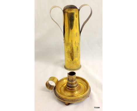 A trench art candle holder made from a 4 inch diameter shell and a trench art twin handled vase 9 inches tall engraved Libert