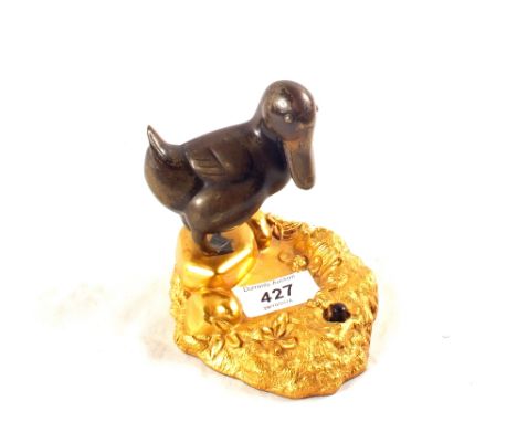 A bronze duck on gilt metal base, signed Puchegger, height 4 1/2"