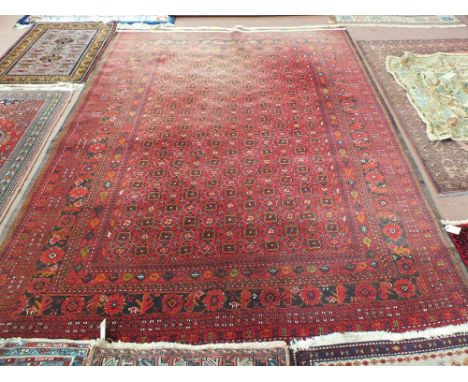 A Persian red ground floral carpet, 120" x 80"