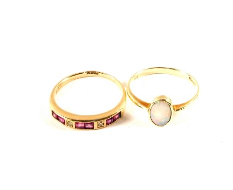 A 9ct Gold Opal set ring and a 9ct Gold Ruby and Diamond half eternity ring