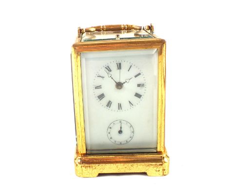 A Brass cased repeater alarm carriage clock