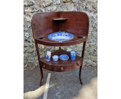 A Georgian mahogany corner washstand; together with a blue and white basin set. 