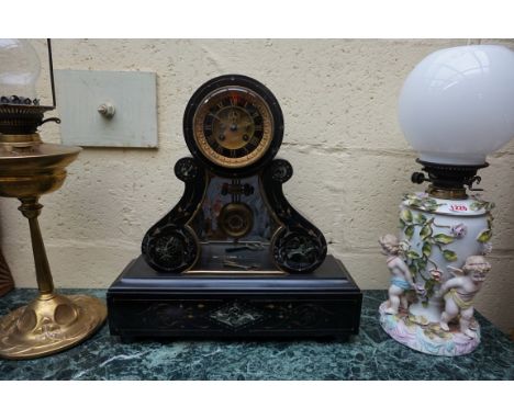 A 19th century slate and marble mantel clock, 45.5cm high, with pendulum and winding key.&nbsp; 