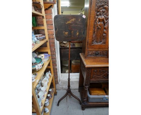 An early 19th century mahogany pole screen,&nbsp;the panel painted with figures in a landscape, 29.5 x 37.5cm.&nbsp; 