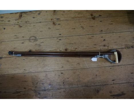 A vintage shooting stick;&nbsp;and another ivory handled cane.&nbsp; 