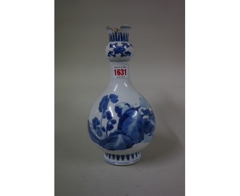 A Chinese blue and white garlic-neck bottle vase, probably Kangxi, 24cm high, (damage to top rim). 