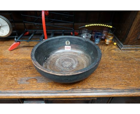 An old turned wood bowl, with ring handle, 28cm diameter. 