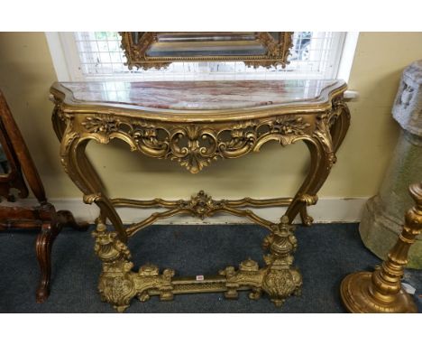 A Louis XV style giltwood and marble top console table,&nbsp;142cm wide.&nbsp; 