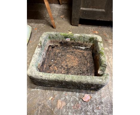 A stone basin, 54cm wide. 