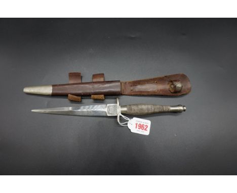 A Fairbairn-Sykes commando knife by Wilkinson Sword, with leather sheath.&nbsp;