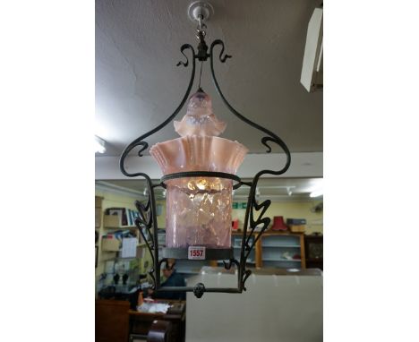 An Art Nouveau ceiling light, with pink vaseline glass shades, 61cm high.&nbsp;&nbsp; 