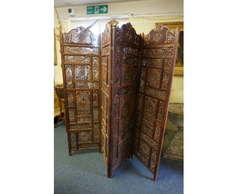 An eastern carved and pierced hardwood four fold screen,&nbsp;each panel 189 x 50.5cm.&nbsp; 