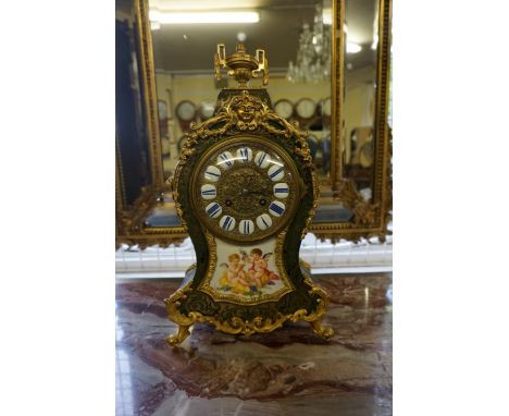 A good 19th century green tortoiseshell, boulle, and porcelain mantel clock,&nbsp;the movement signed 'W Oppenheim', striking