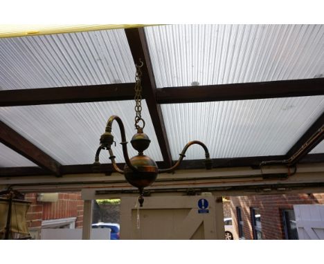 An old brass or copper three branch ceiling light.&nbsp; 
