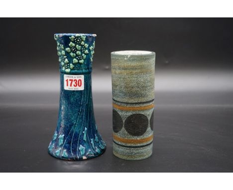 A Liberty &amp; Co pottery vase,&nbsp;with stylized&nbsp;relief decoration, 18cm high, (glaze chips); together with a Troika 