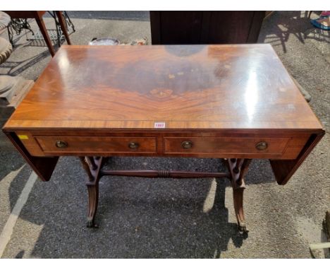 A reproduction mahogany sofa table,&nbsp;95cm wide x 76cm high x 53cm deep.&nbsp; 