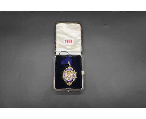 A circa 1930 silver gilt and enamel 'Nottingham &amp; District Butcher's Association' neck badge, 6cm high, in fitted case.&n