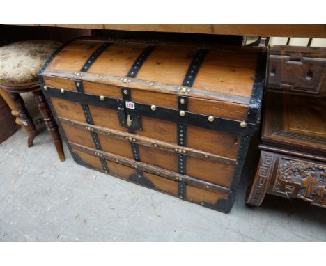 A pine and metal bound dome top trunk, 76cm wide. 