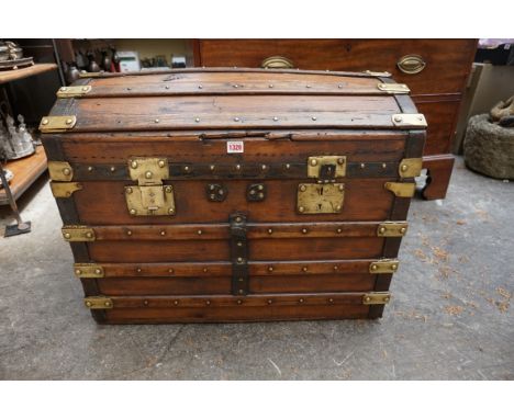An old pine and brass bound dome top trunk, 77cm wide. 