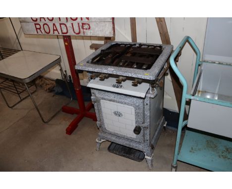 A 1930's mottled enamelled mains gas cooker (sold as collector's item)