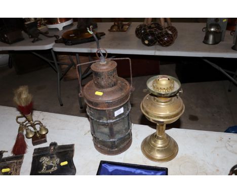 A vintage lamp converted to electricity - sold as collector's item and a brass oil lamp lacking shade and chimney