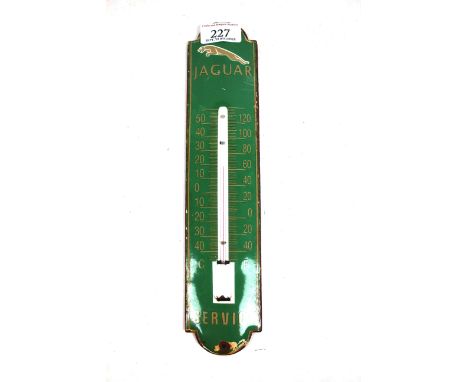 An enamel garage advertising thermometer for Jaguar