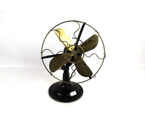 A vintage fan with brass blades - sold as a collector's item