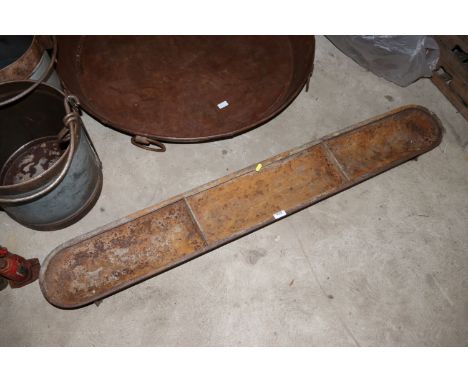 A cast iron three section trough