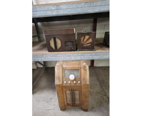 An Art Deco period walnut radiogram having Bakelite handles (case wormed), a table top radiogram and an Art Deco speaker