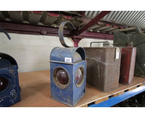 A blue painted Watchman roadside warning lamp