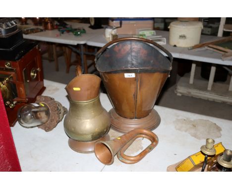 A copper coal helmet, a brass and copper baluster jug and a copper and brass bugle AF