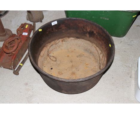 A circular cast iron quenching trough 