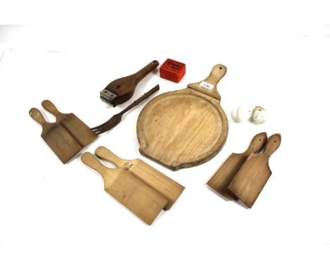 A collection of domestic treen to include a lemon squeezer, butter pats, chopping board etc.