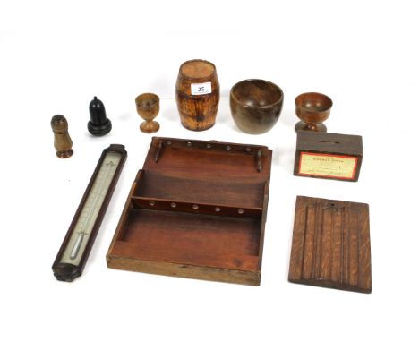 A collection of various Treen including a Georgian mahogany framed thermometer, egg cup, pepperette, salts, pipe rack etc.