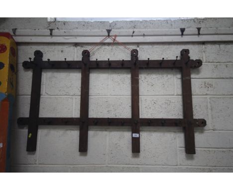 A vintage pine utensil rack