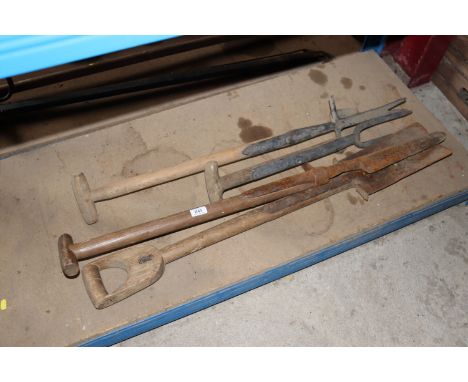 A vintage drainage spade, two root lifters and another spade