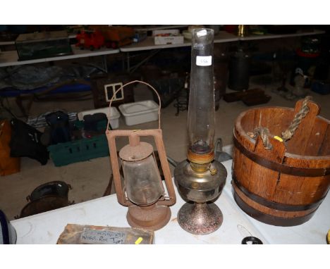 An oil lamp and a vintage hurricane lamp 