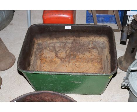 A vintage green painted cast iron quenching trough 
