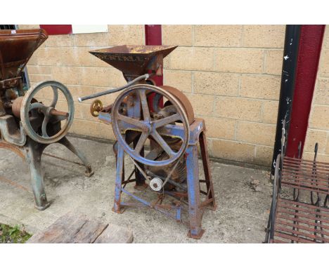 A vintage cast iron corn mill with electric motor - sold as collector's item 