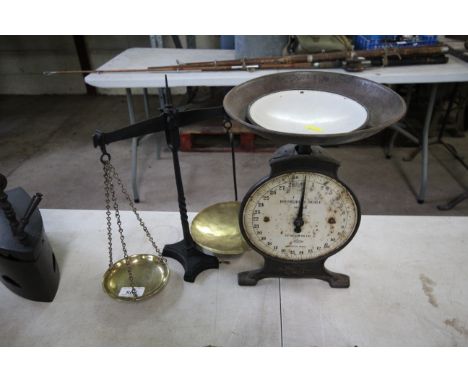 A set of iron and brass balance scales and a household scale 