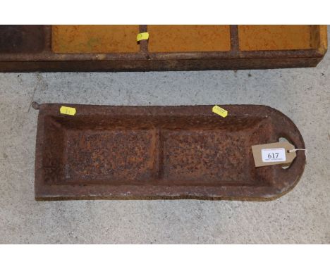 A small cast iron two section drinking trough 