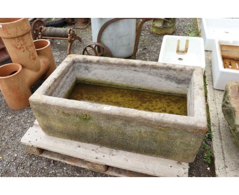 A large antique stoneware trough, approx. 42" long x 24" deep x 15" high