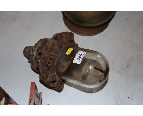 A vintage heavy duty outdoor bulkhead lamp