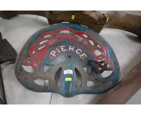 A vintage cast iron tractor seat "Pearce"