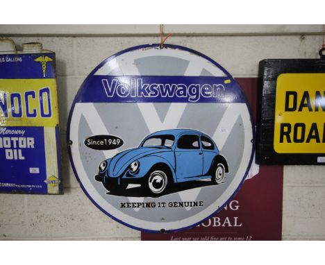 A circular "Volkswagen" enamel advertising sign, approx. 30" dia.