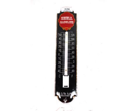 An enamel garage advertising thermometer for Shell Gasoline